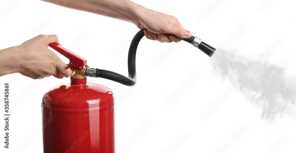 Ταπετσαρία Woman using fire extinguisher on white background, closeup