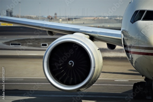 ABU DHABI, U.A.E - JANUARY 08, 2018: Close up image of plane jet engine, airplane on the runway of abu dhabi airport