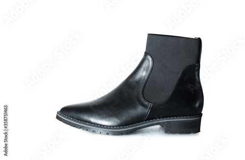 black patent leather autumn or spring boots on a white background isolated © alenaslostina