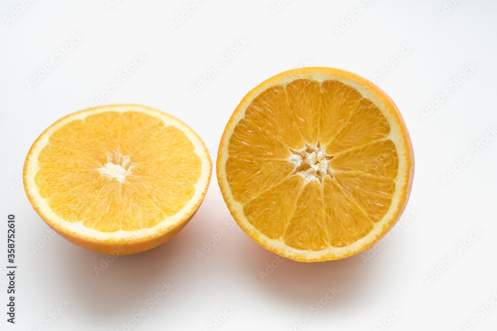 orange on a white background, slices of orange, oranges in circles, cut orange