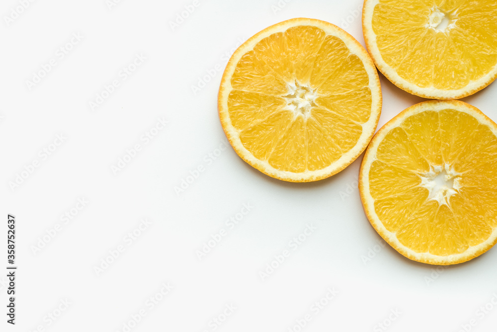 orange on a white background, slices of orange, oranges in circles, cut orange orange on a white background, slices of orange, oranges in circles, cut orange