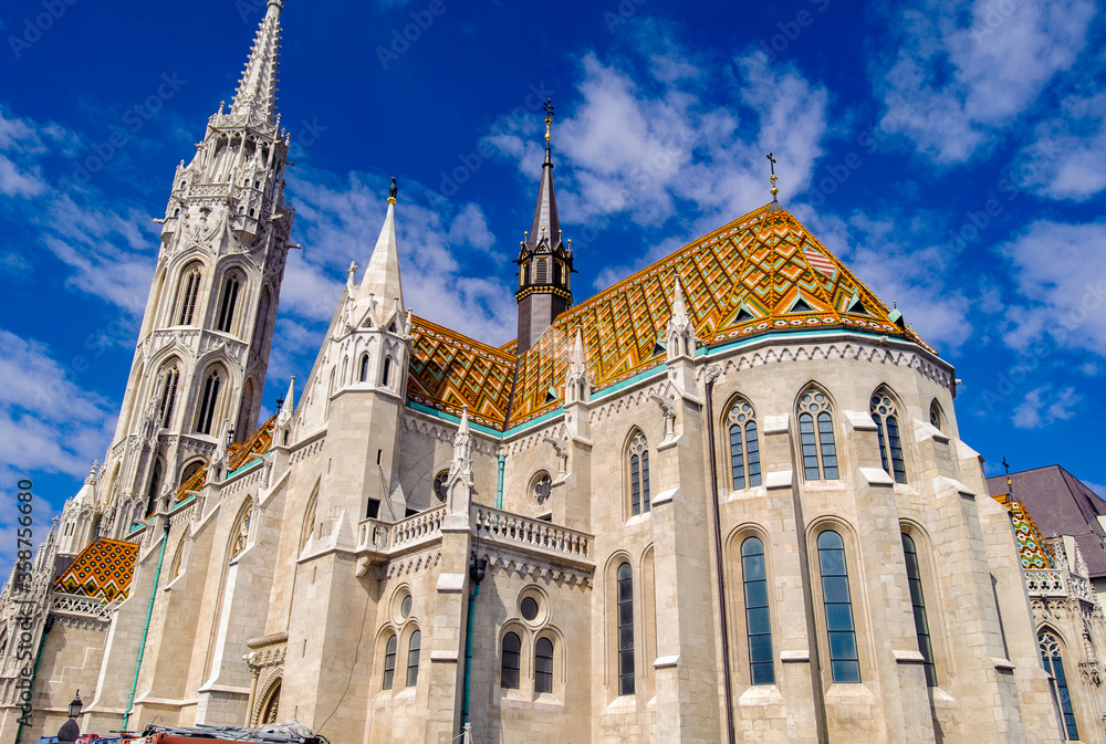 It's Matthias Church, a church located in Budapest, Hungary, in front of the Fisherman's Bastion at the heart of Buda's Castle District.