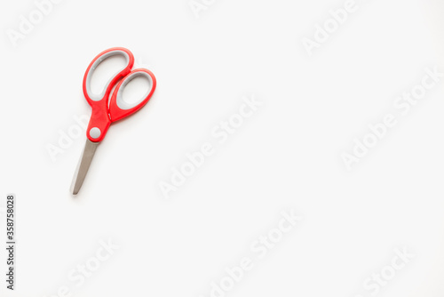 scissors with red handle  stationery scissors on a white background