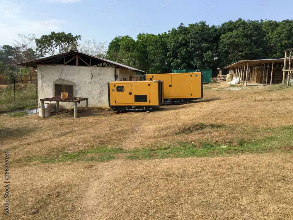 Africa, Liberia, Monrovia, Houses for expatriate workers with generators near it. Typical local power supply.