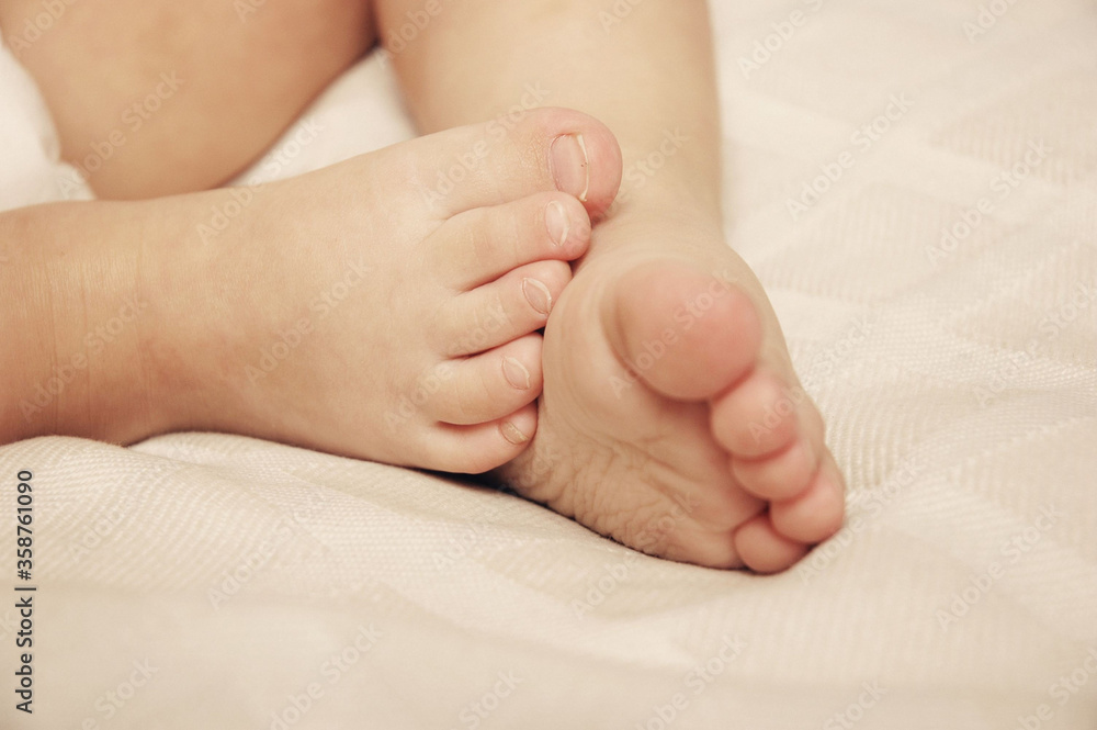 Baby feet detail at bedroom Baby feet detail at bedroom