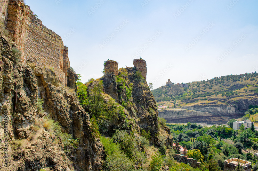It's Narikala Fortress, an ancient fortress overlooking Tbilisi, the capital of Georgia, and the Kura River.