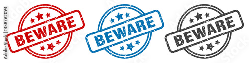 beware stamp. beware round isolated sign. beware label set