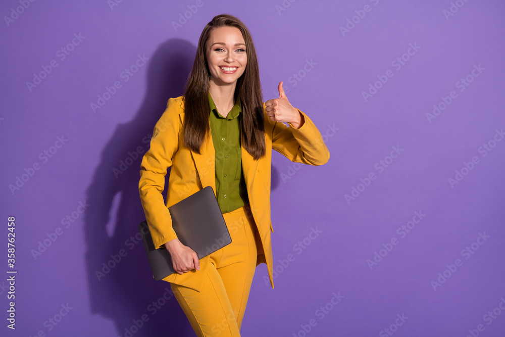 Portrait of positive ceo successful marketer girl show thumb-up sign approve laptop holding workshop seminar wear trousers blazer isolated over purple color background Portrait of positive ceo successful marketer girl show thumb-up sign approve laptop holding workshop seminar wear trousers blazer isolated over purple color background