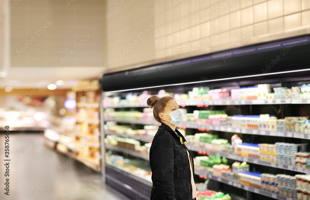 supermarket shopping, face mask and gloves,Woman choosing a dairy products at supermarket	