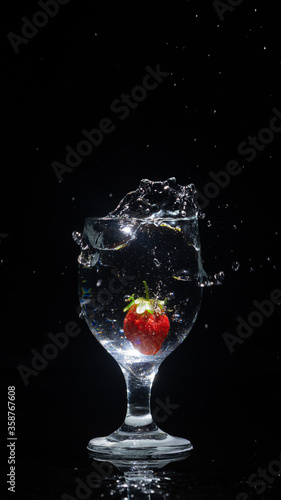 strawberry in a glass of water