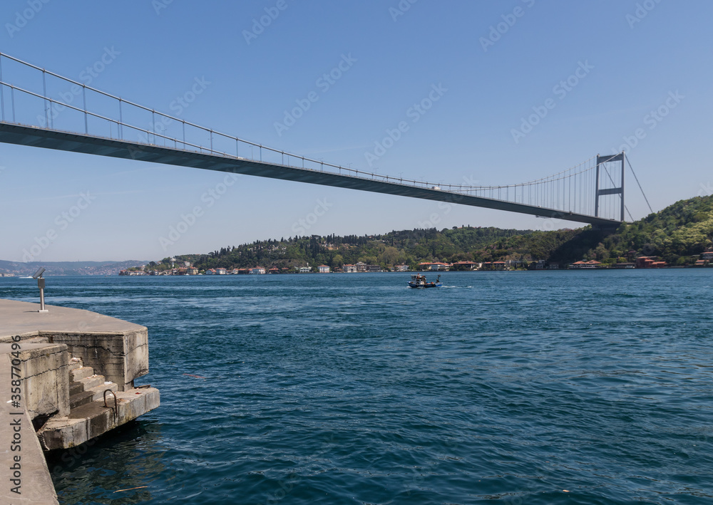 Istanbul, Turkey - completed in 1988 and one of the main landmarks in Istanbul, the Fatih Sultan Mehmet Bridge connects Europe and Asia. Here in particular the suspension bridge structure Istanbul, Turkey - completed in 1988 and one of the main landmarks in Istanbul, the Fatih Sultan Mehmet Bridge connects Europe and Asia. Here in particular the suspension bridge structure