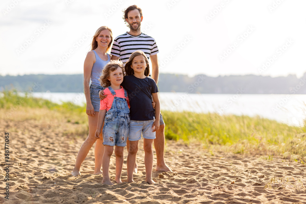Young family enjoying time at the beach 
