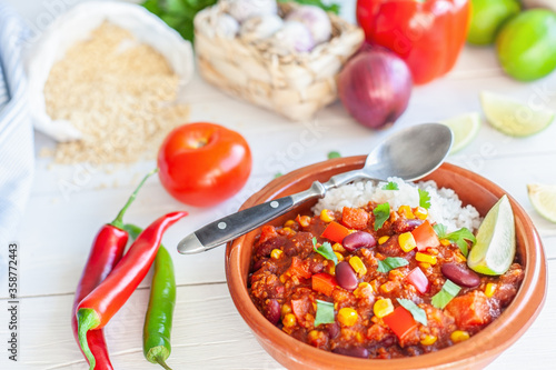 Vegan mexican chili based on soy granules with ingredients closeup