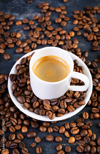 Cup of coffee espresso. Hot drink coffee on dark background