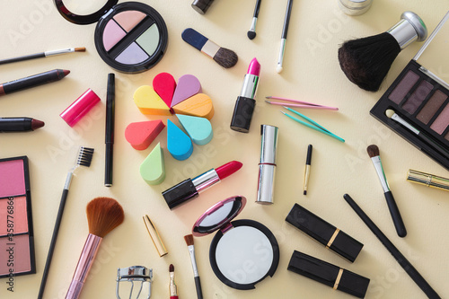 Make up cosmetics products against yellow color background