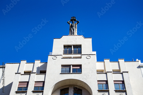 It's Statue on the Hotel on the Gran Via street (Great Way), Madrid, Spain. Gran via is known as the the street that never sleeps or as Spanish Brodway photo