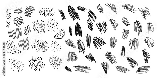 A set of different brushstrokes. Black scribbles on a white background.