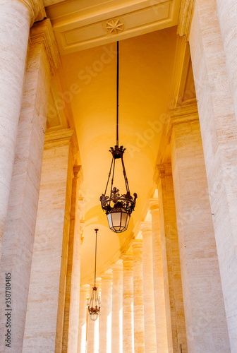 Lamp among the columns on the Saint Peter's square in Rome, Italy