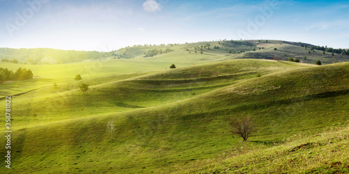 landscape with green hills and blue sky. © Сергей Чирков