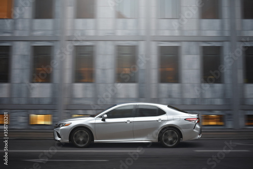 Copenhagen / Denmark - 07.25.19: Motion on high speed of expensive car in a business district