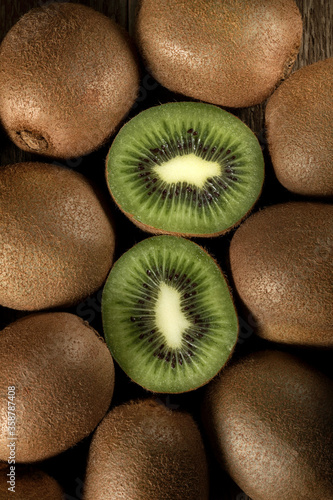 Fresh biologic Kiwi fruit on a wooden table.