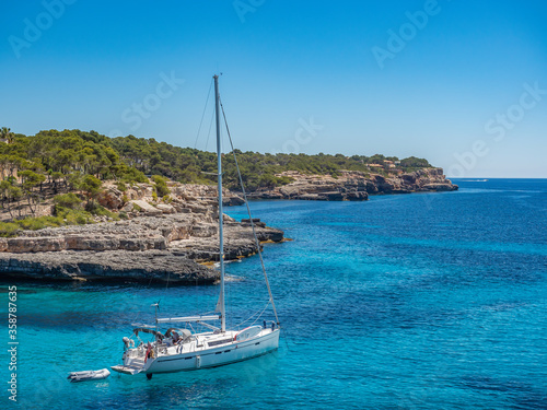 Mondragó Natural Park Mallorca Spain ocean going yacht sailing out into the mediterranean © Cliff