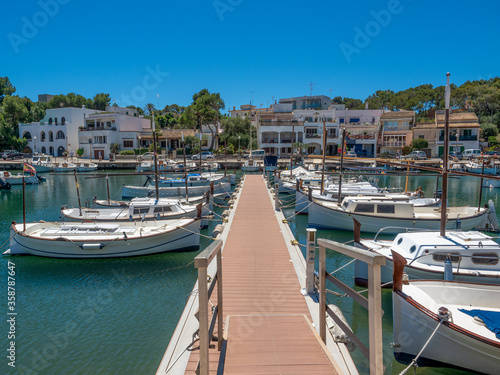 Porta Petro Mallorca Spain fishing harbor with traditional fishing boats moored
