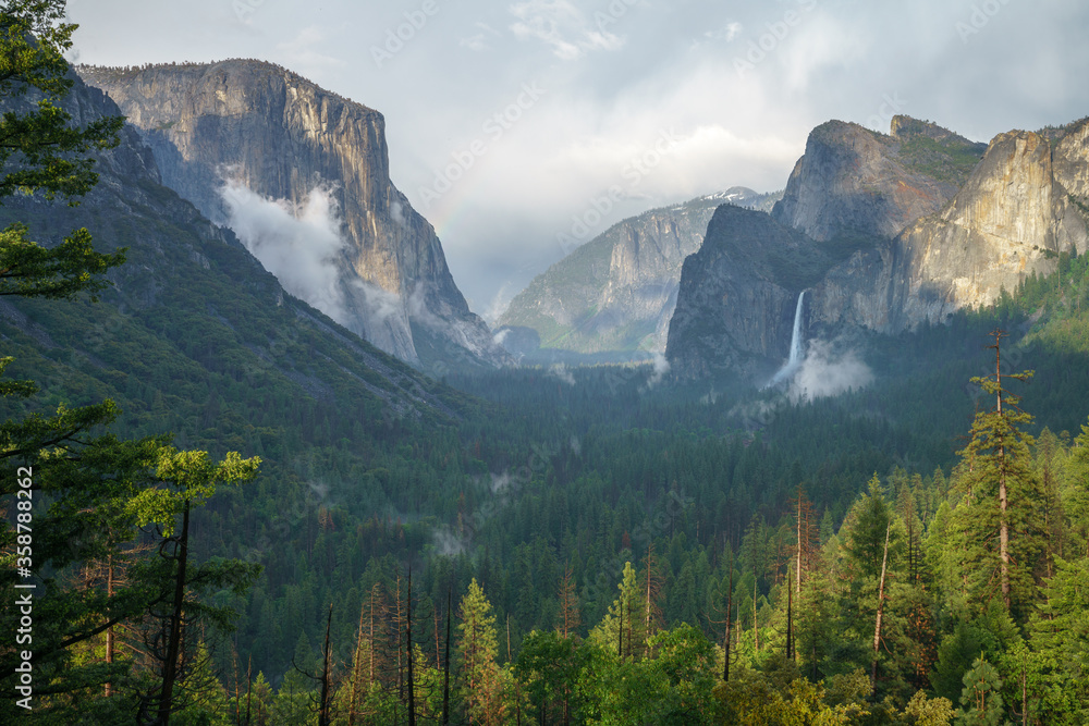 rainbow at the tunnel view in yosemite national park in california, usa rainbow at the tunnel view in yosemite national park in california, usa