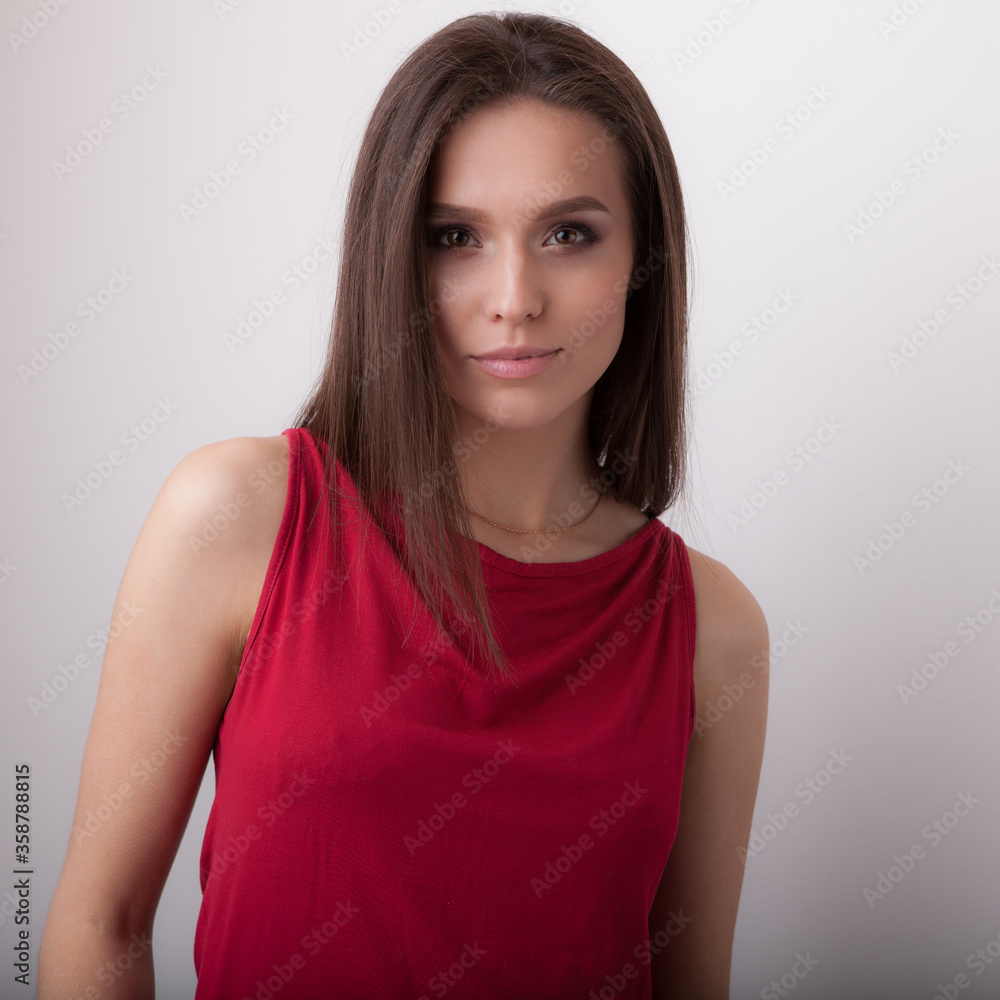 Young beautiful stylish girl posing in studio. Young beautiful stylish girl posing in studio.