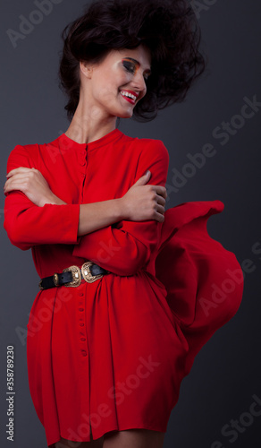 Young beautiful stylish girl posing in studio.