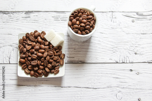 Coffee beans and sugar cubes for cooking breakfast. Copyspace for text. Top view. Flatlay