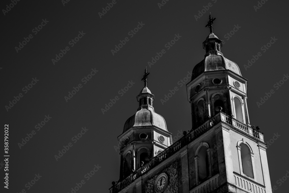 Church towers in dramatic light in black and white