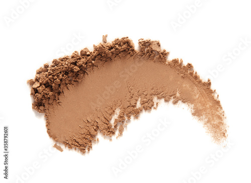 Bronzer or eye shadow swatch smear smudge isolated on white. Brown makeup face powder