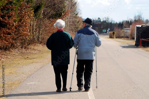 older people doing nordic walking photo