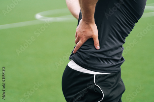 Close up of the man's hands hold the waist. The head of the department accident at training