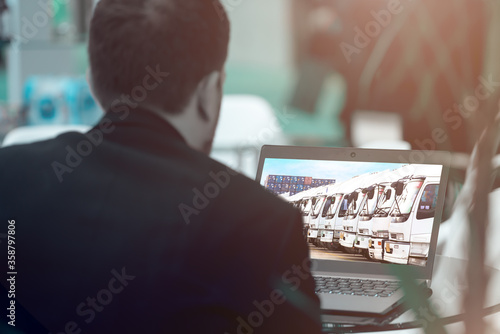 Logistic Concept, Manager working with laptop and smartphone for Import Export background