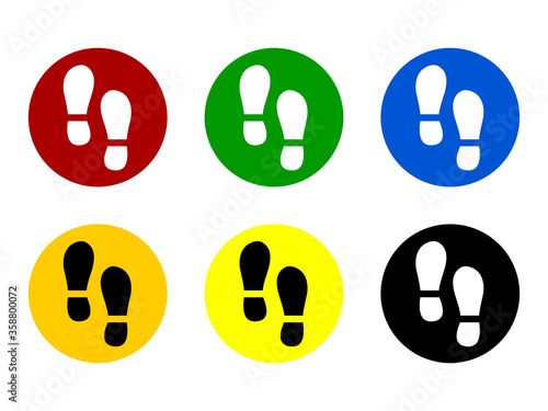Set of Round Floor Marking Adhesive Sticker Icons with Different Colors and Shoeprints or Footprints for Queue Line or Other Purposes Requiring Social Distancing. Vector Image.