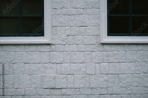 Vintage windows of house with white wall
