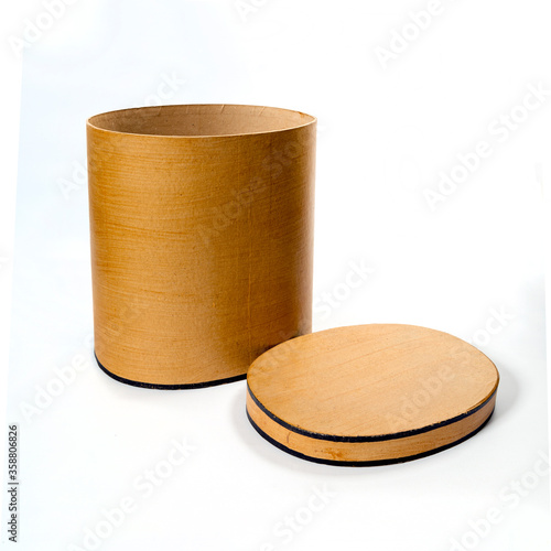 Photography image of a vintage hatbox isolated on white. The cover is near