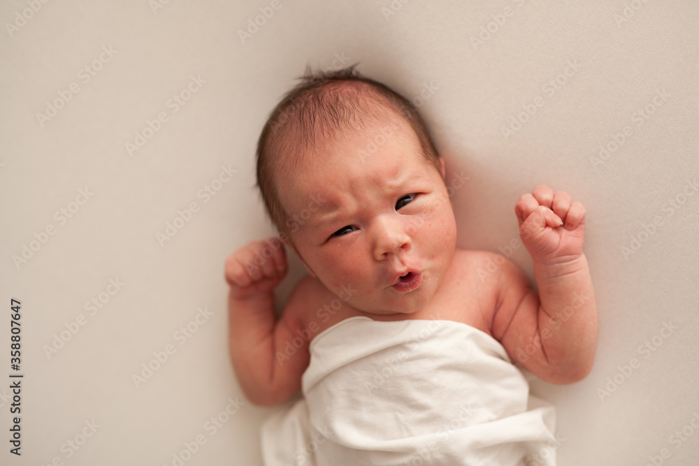 Portrait of a newborn baby boy with emotion on his face Portrait of a newborn baby boy with emotion on his face
