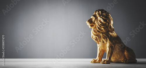 Golden statue of lion, a sculpture. Concept of a strength, power
