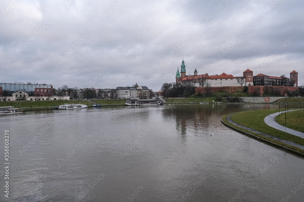 
General view of Wawel Royal Castle   as seen from the south bank of the west bend of Vistula river, Krakow, Poland.
