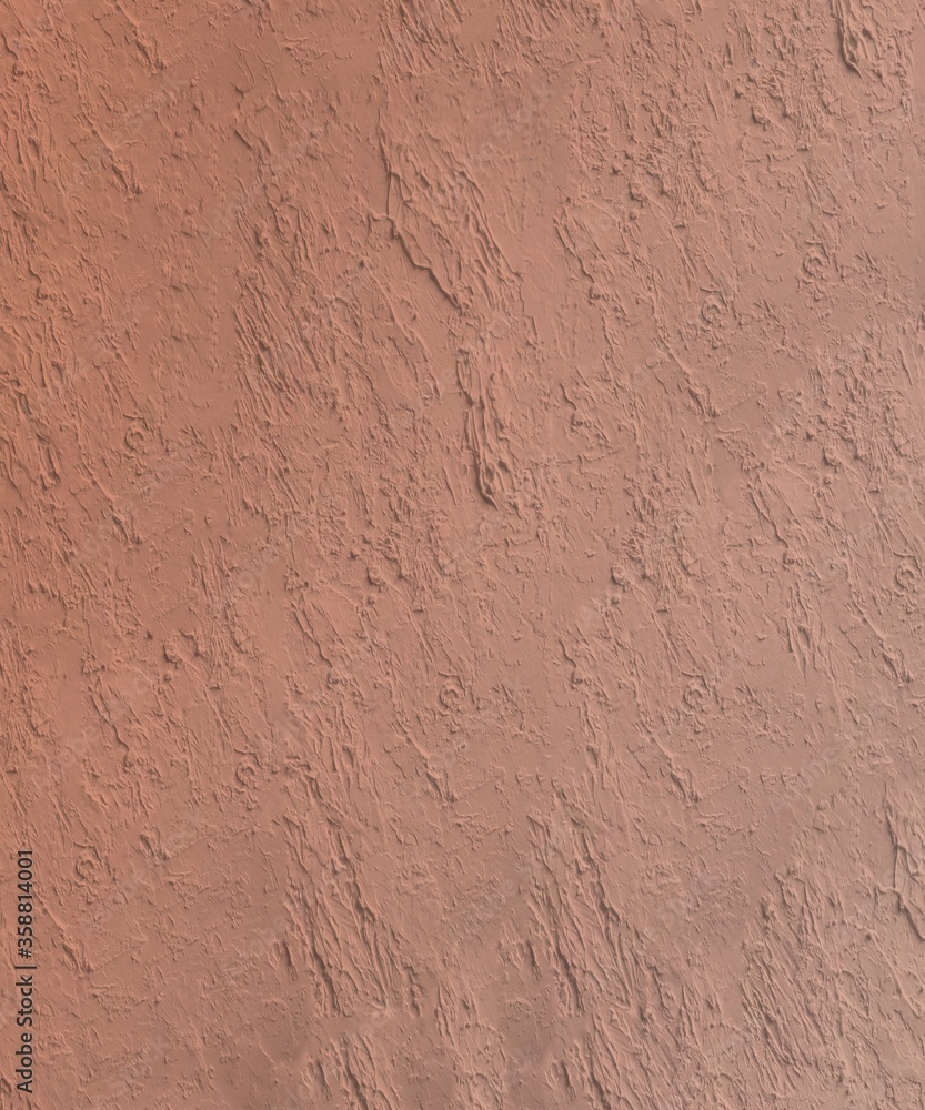 Stucco wall thick texture in light orange brown color Stucco wall thick texture in light orange brown color