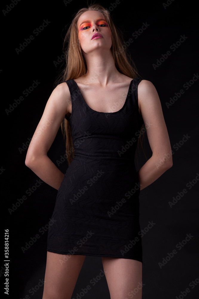 Young beautiful stylish girl posing in studio. Young beautiful stylish girl posing in studio.