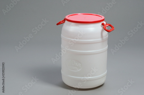 Plastic white food barrel, with red lid, container, for liquids, on a white background, online store