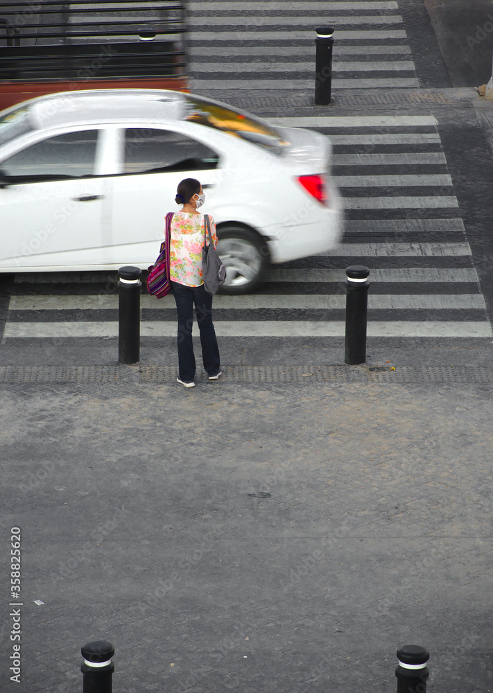 Women crossing road with social distancing