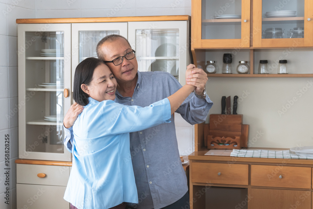 Elderly couple Dance in kitchen happily Elderly couple Dance in kitchen happily