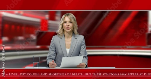 Caucasian beautiful woman presenter reading news and explaining emotionally while sitting in studio at desk with laptop computer. Red background. Female journalist broadcasting on air in evening on TV
