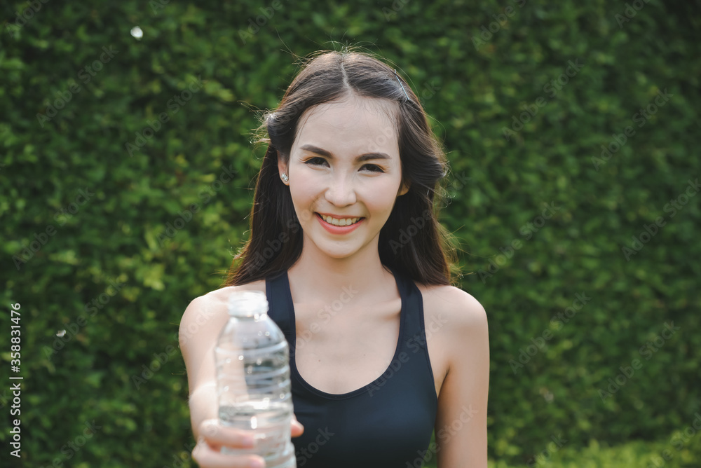 sporty woman drinking water after workout sporty woman drinking water after workout