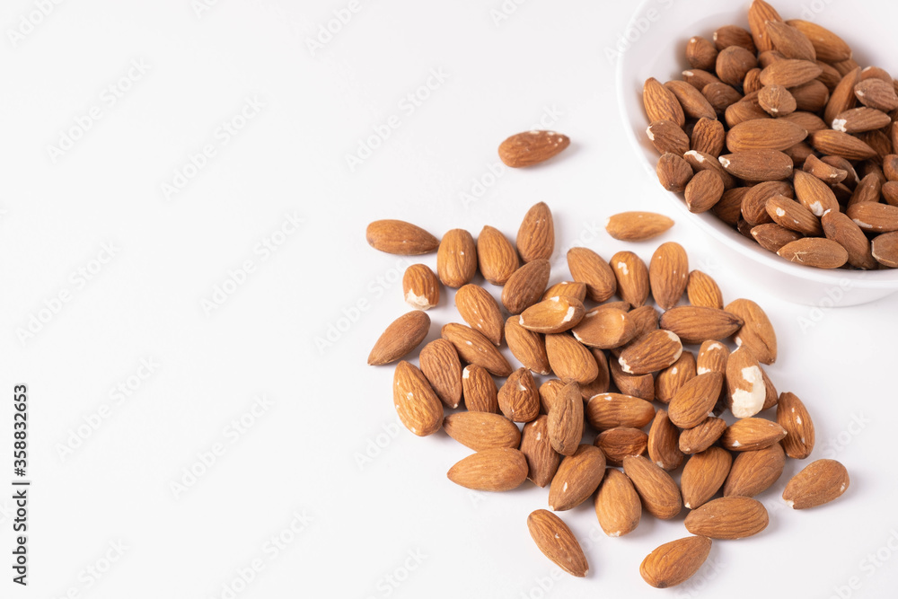 piece of almonds are scattered on a table piece of almonds are scattered on a table